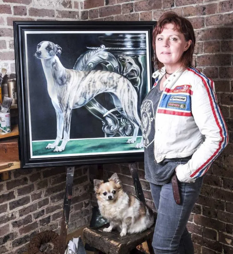 Sara Abbott with painting - A portrait of whippet winner of Best in Show at Crufts